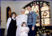 Christina with her dad, Mike and stepmother, Kim at the Christening of her stepsister, Sabrina